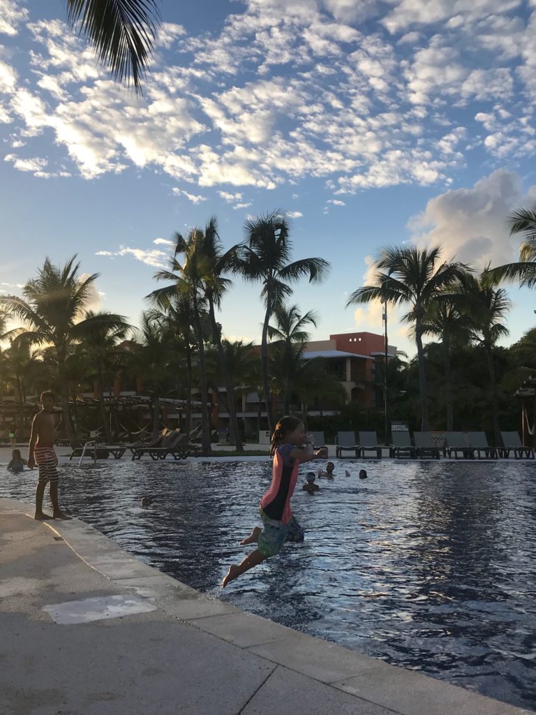 Kid jumping into Barcelo Maya pool - Real Life With Dad