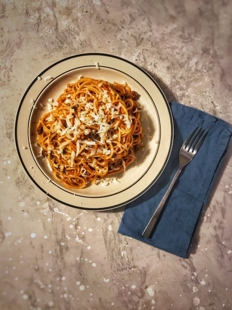 Short rib pasta sprinkled with shredded fontina.