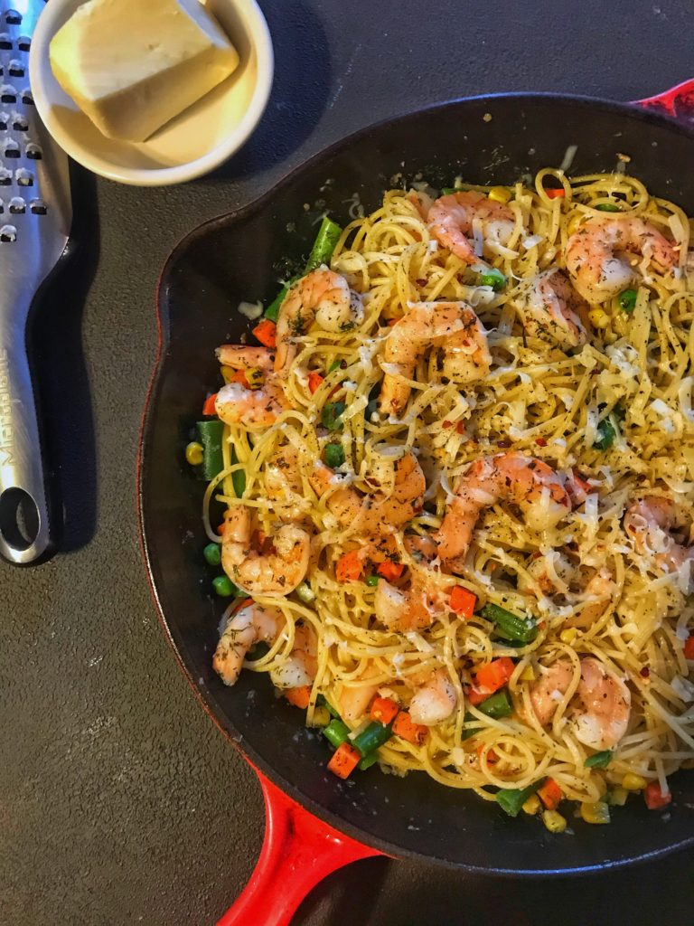 Plump shrimp tossed with spaghetti and vegetables. This is good eating!
